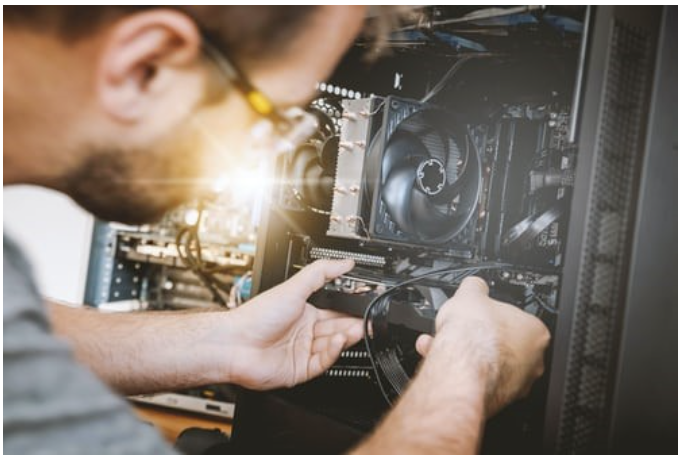 Field service technician repairing and maintaining computer equipment